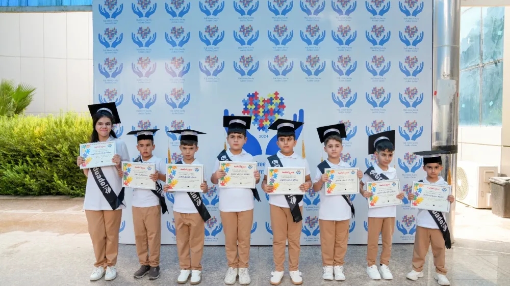 Children holding certificates at a foundation graduation